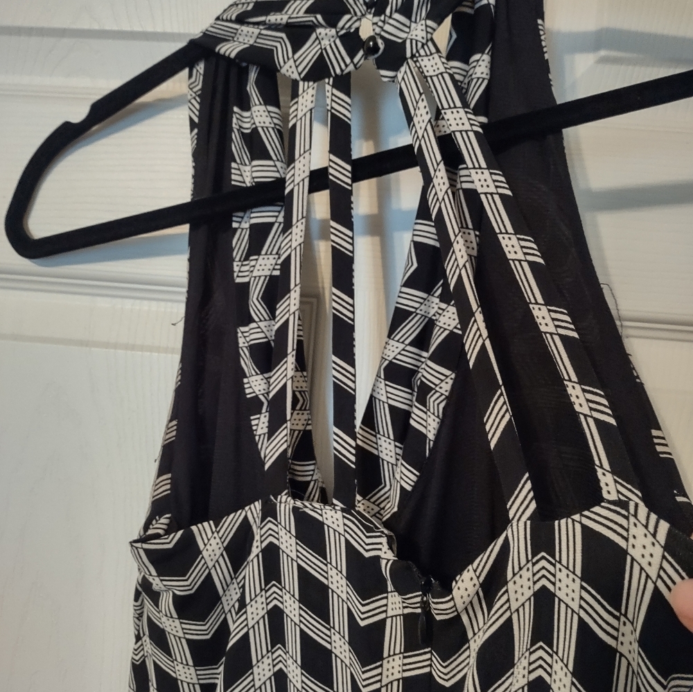 Versona Jumpsuit.The back has 6 straps and elegant. lm 5'4" and it's too long